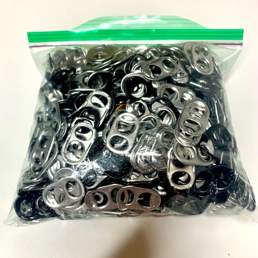 Sandwich Ziploc bag full of soda pop tops
